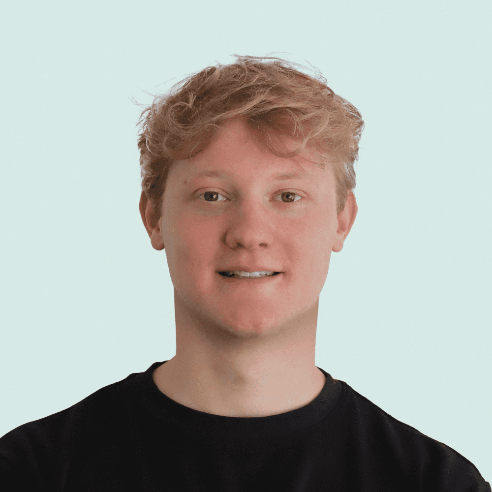 Portrait of a person in dark clothing speaking on a phone